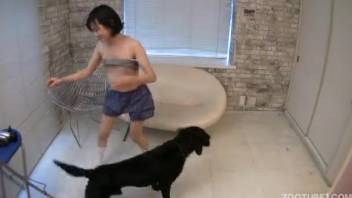 Young Asian girl 18+ stuffs enormous canine dick into her mouth in homemade bestiality blowjob