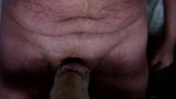 Guy aggressively throat-fucking an obedient female on video