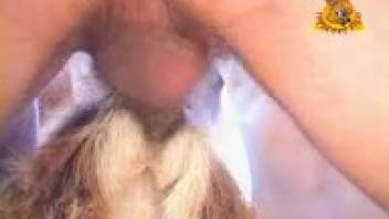 Guy thrusts his cock deep into the beast's cunt