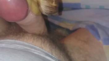 Guy oozing pre-ejaculate as snails crawl over his dick