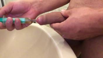 Guy jerks off in the bathroom with a parasite in his penis