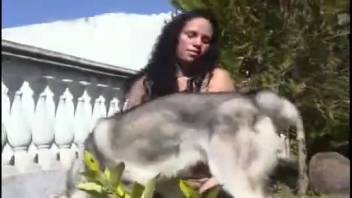 Outdoor animal sex triple-X with a dark-haired woman and her canine companion