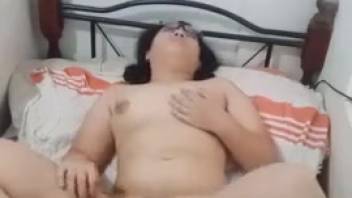 Hot Asian babe with a bushy vagina loves animal oral action