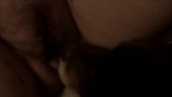 Nude woman with bushy pussy engages in close-up oral bestiality with the dog