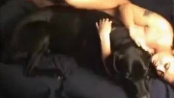 Dark-haired woman and her ebony-furred canine engage in nasty bestiality XXX action
