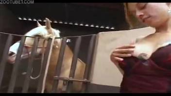 Intense zoophilia sequences with a blonde woman attempting to insert a horse's penis into herself