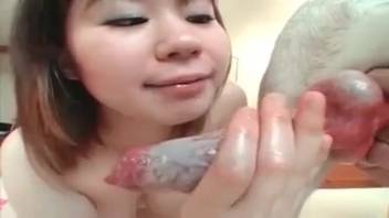 Asian whore recorded deepthroating the canine's cock attentively