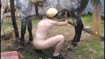 Bobbed-haired young girl pleasures herself using a stallion's thick cock