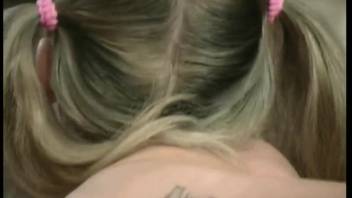 Braided-haired young adult orally pleasing and copulating with a large-membered canine